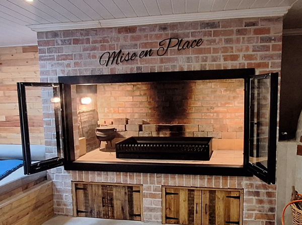 Custom Frame with Stacker Glass Doors added to customer's brick fireplace